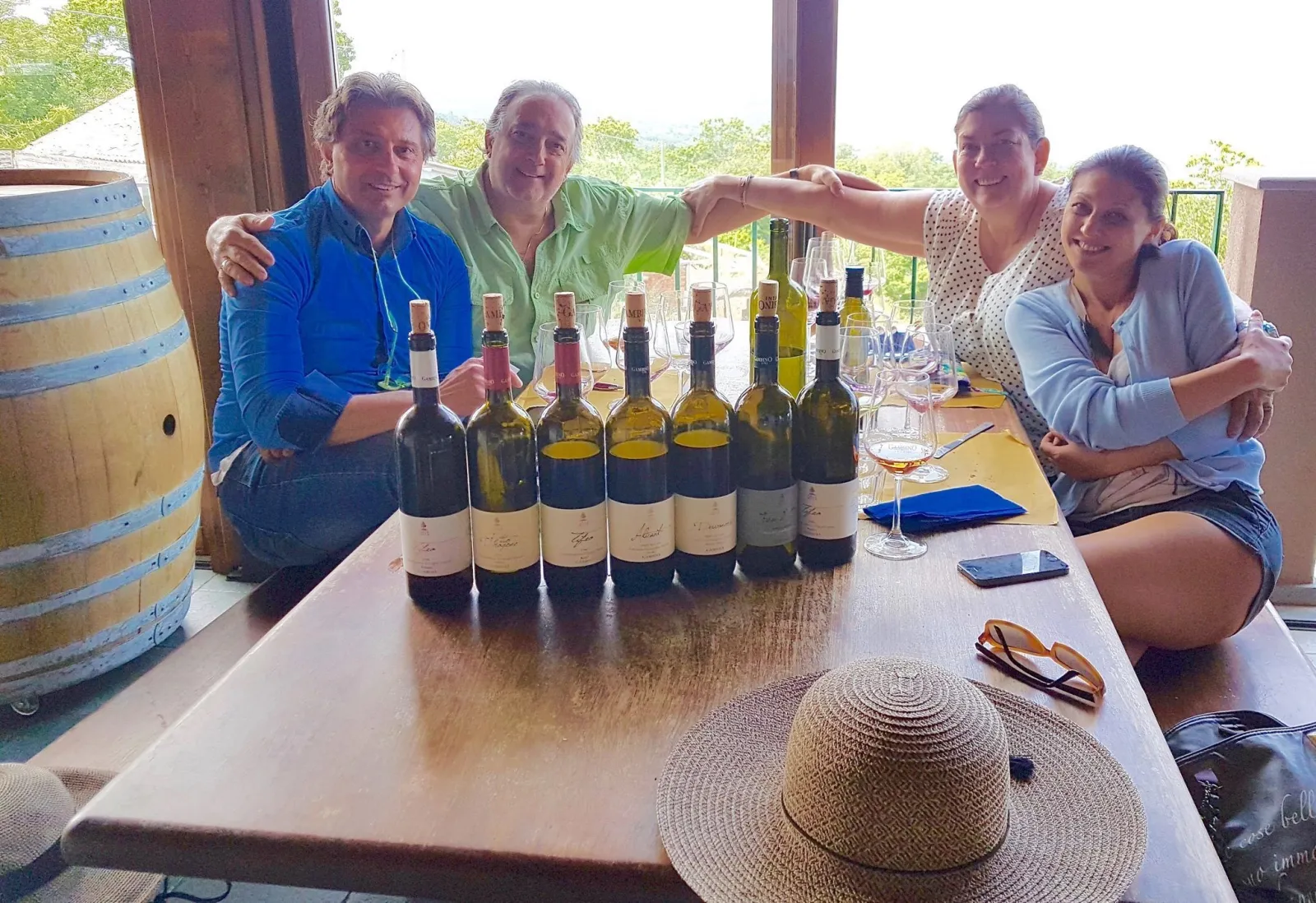 Guests at a long table with the estate's bottles lined up in front of them