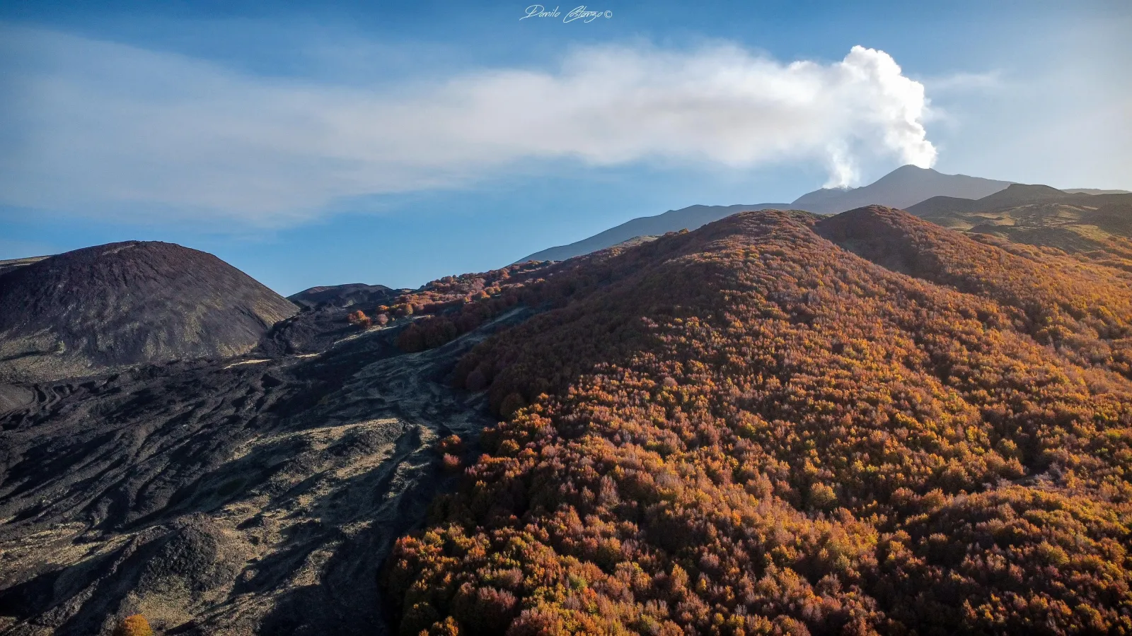 The rust-coloured flank of a spent cinder cone high on Etna's northern side