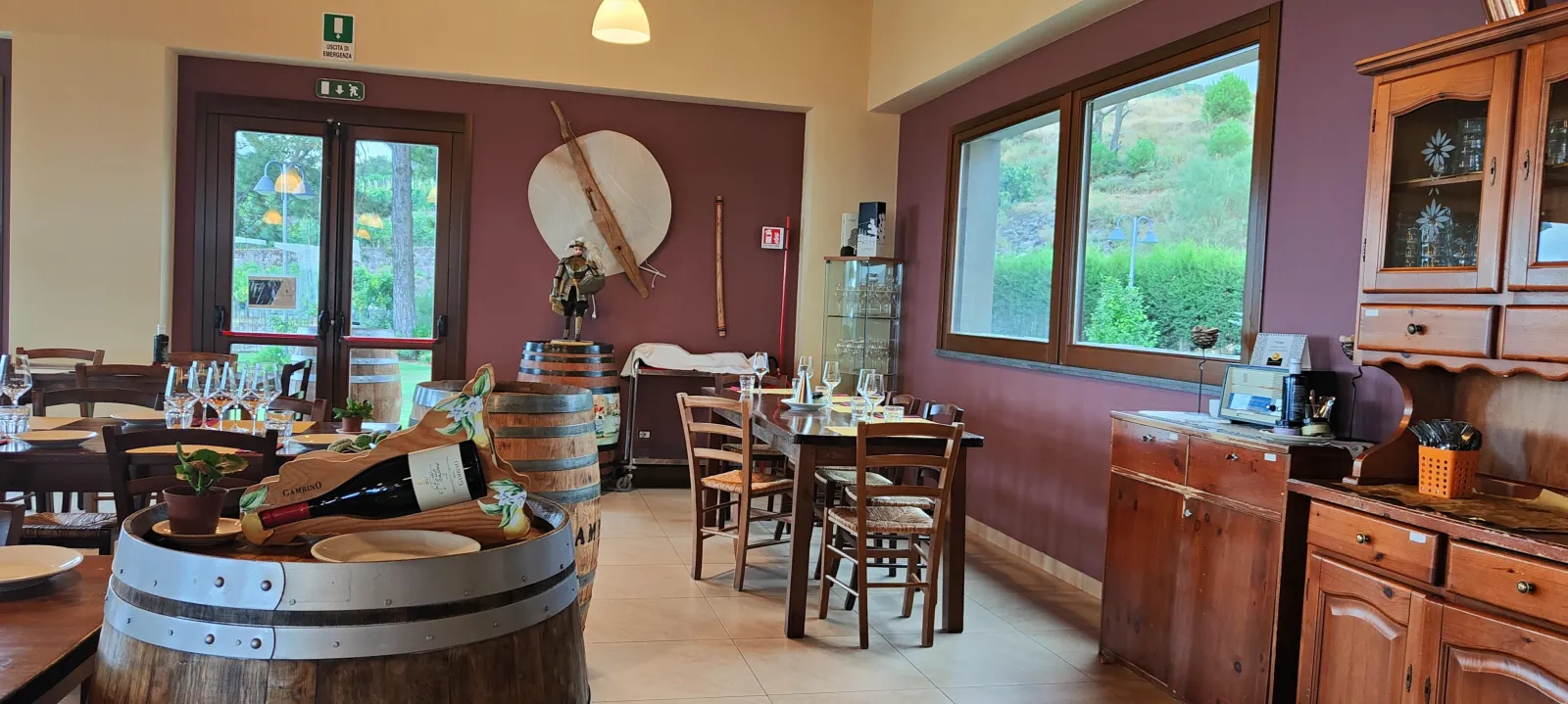 Barrel-top tables set for a tasting inside the winery's timber-lined room