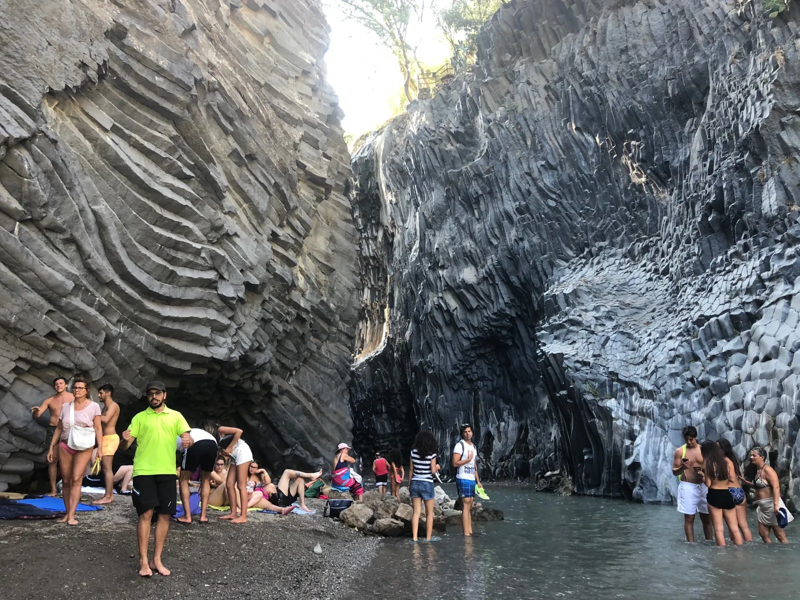 Visitors in the Alcantara gorge where the river cut down through basalt